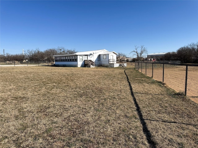 view of yard with a rural view