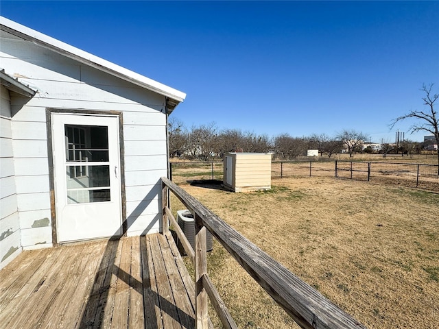 view of yard with a shed and a wooden deck