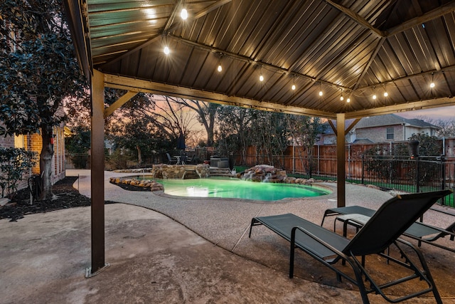 view of swimming pool with a patio area and pool water feature