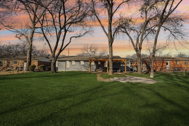 ranch-style house with a front lawn and a carport