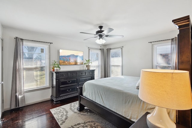 bedroom featuring ceiling fan and dark hardwood / wood-style floors