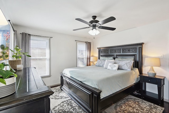 bedroom with ceiling fan and wood-type flooring