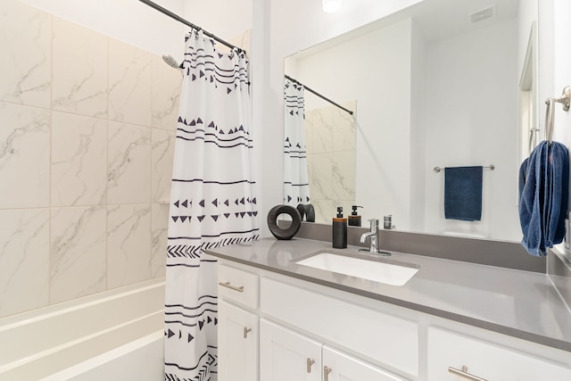 bathroom with shower / bath combo and vanity