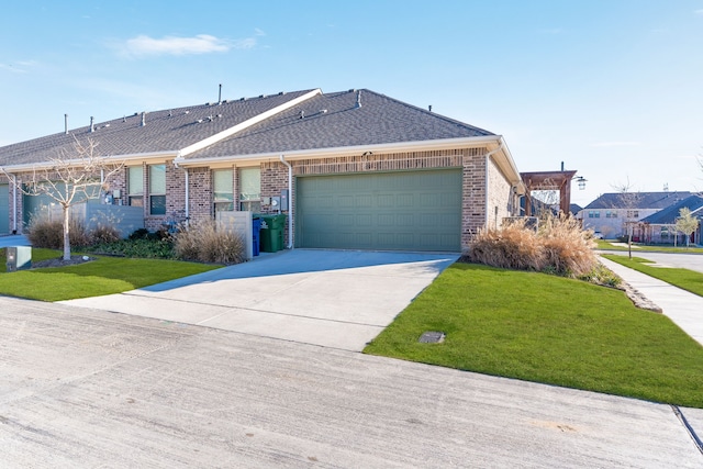 single story home with a garage and a front lawn