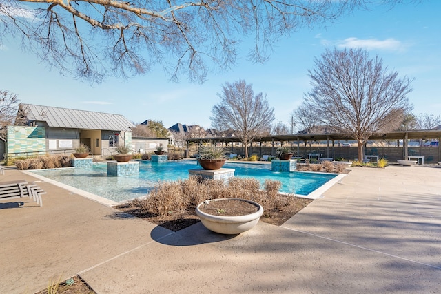 view of pool with an outdoor structure and a patio area