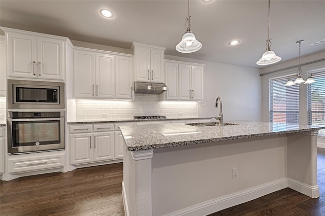 kitchen with white cabinetry, sink, a center island with sink, and appliances with stainless steel finishes