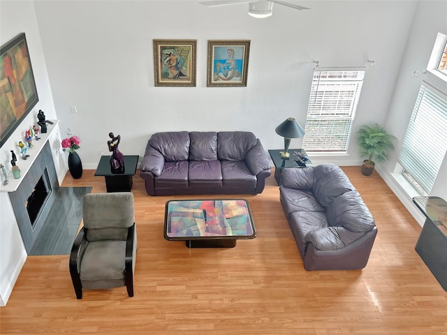 living room with hardwood / wood-style floors and ceiling fan