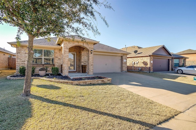 view of front facade with a front yard and a garage