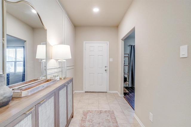 corridor with light tile patterned floors