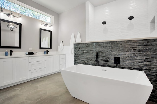 bathroom with vanity, tile walls, tile patterned floors, and a bathing tub