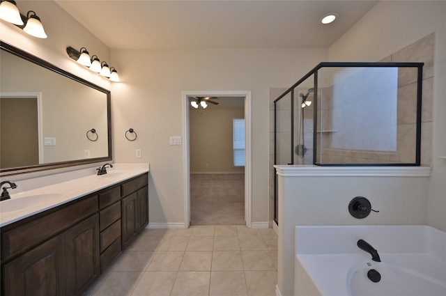 bathroom featuring independent shower and bath, tile patterned floors, and vanity