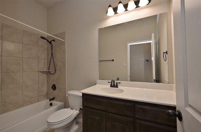 full bathroom featuring toilet, vanity, and tiled shower / bath combo