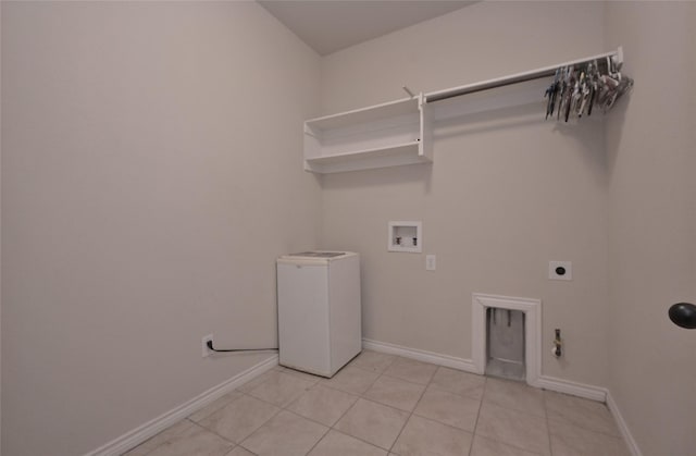 clothes washing area with light tile patterned floors, electric dryer hookup, gas dryer hookup, and hookup for a washing machine