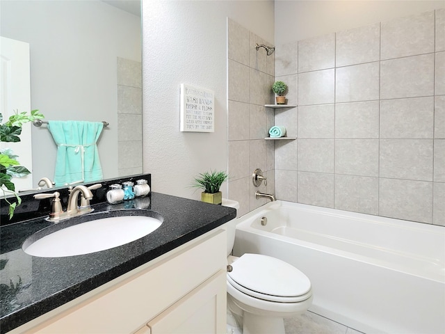 full bathroom featuring tiled shower / bath combo, toilet, and vanity