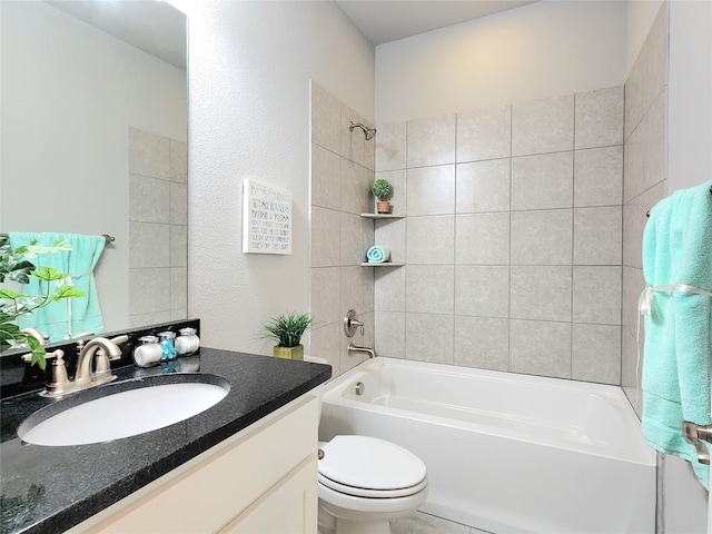 full bathroom featuring toilet, vanity, and tiled shower / bath combo