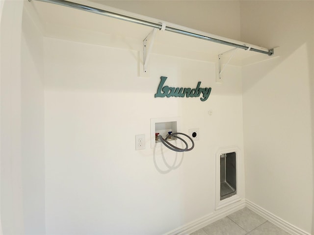 washroom featuring washer hookup, light tile patterned floors, and hookup for an electric dryer