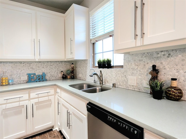 kitchen with decorative backsplash, sink, white cabinets, and dishwasher