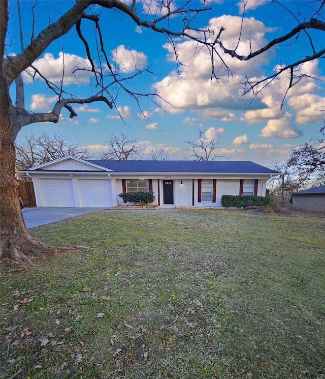 ranch-style home with a front yard and a garage