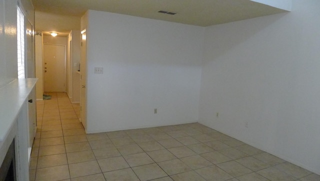 empty room with light tile patterned flooring