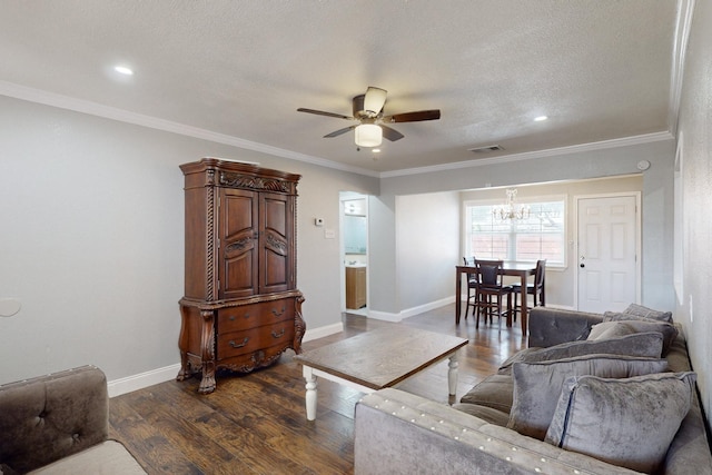 living room with crown molding, dark hardwood / wood-style flooring, ceiling fan with notable chandelier, and a textured ceiling