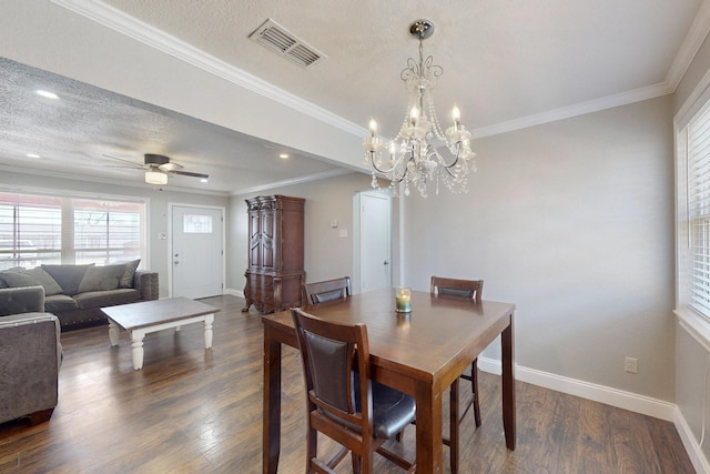 dining room with ceiling fan, crown molding, dark wood-type flooring, and a textured ceiling