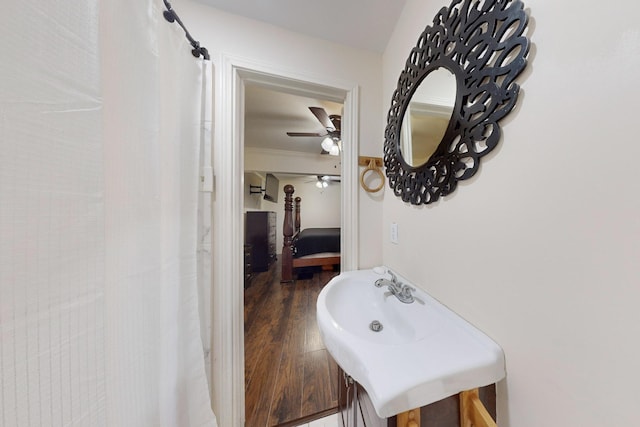 bathroom with ornamental molding, hardwood / wood-style floors, vanity, and ceiling fan