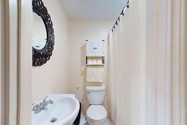 bathroom with sink and toilet