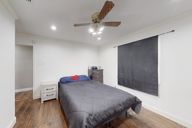 bedroom featuring ornamental molding, dark hardwood / wood-style floors, and ceiling fan