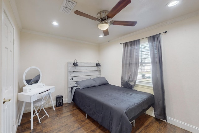 bedroom featuring ornamental molding, dark hardwood / wood-style floors, and ceiling fan