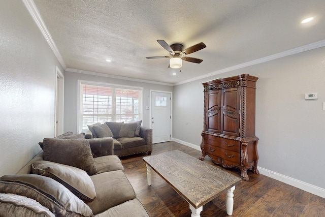 living room with ceiling fan, ornamental molding, dark hardwood / wood-style floors, and a textured ceiling