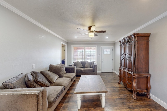 living room with ornamental molding, dark wood-type flooring, a textured ceiling, and ceiling fan