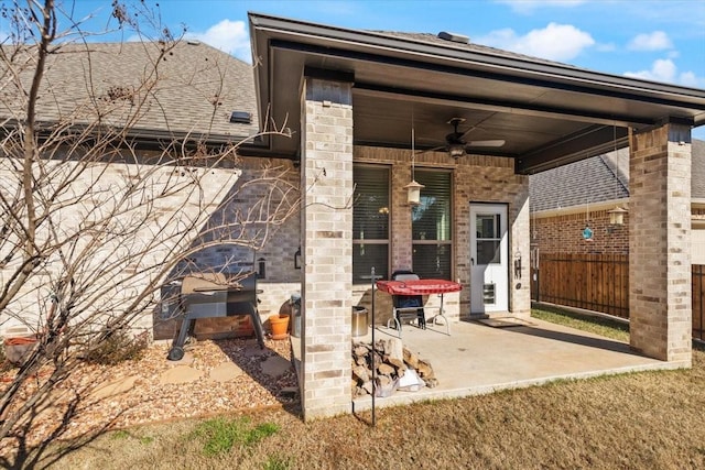 back of property featuring a patio area and ceiling fan