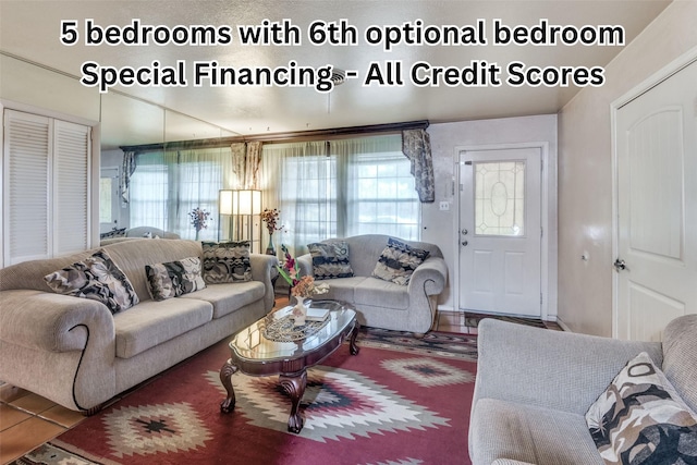 living room with tile patterned floors