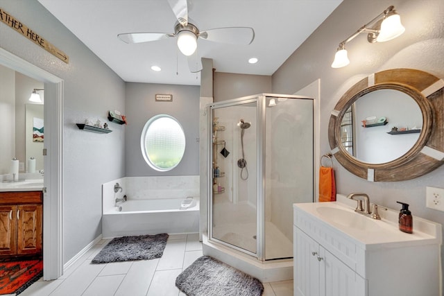 bathroom with ceiling fan, vanity, shower with separate bathtub, and tile patterned flooring