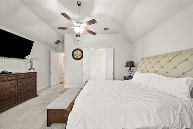 bedroom featuring vaulted ceiling, light colored carpet, and ceiling fan