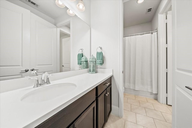 bathroom featuring tile patterned floors and vanity