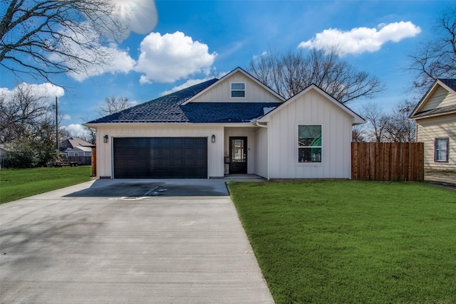 view of front facade featuring a garage and a front lawn