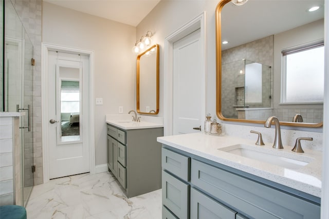 bathroom featuring vanity and a shower with shower door