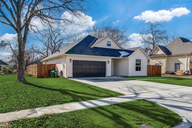 view of front of property featuring a garage and a front yard