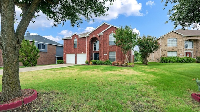 view of front of property featuring a garage and a front yard