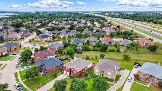 aerial view with a water view and a residential view