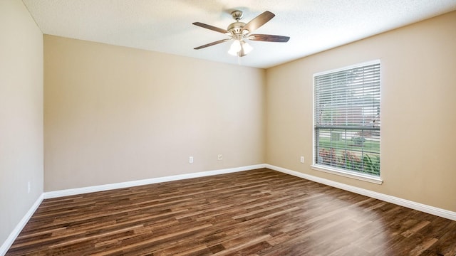 spare room featuring ceiling fan, a textured ceiling, and dark hardwood / wood-style flooring