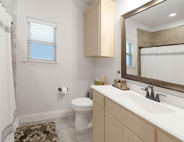 bathroom with a shower with shower curtain, tile patterned flooring, vanity, and toilet