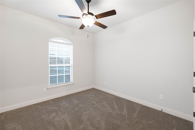 spare room featuring carpet floors and ceiling fan