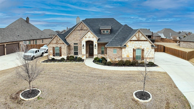 french provincial home featuring a garage