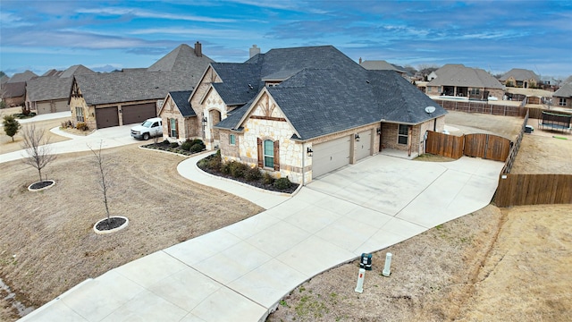 french country inspired facade featuring a garage