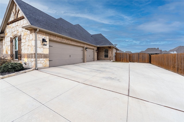 view of side of home with a garage