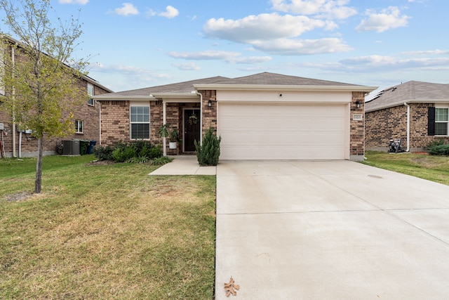 ranch-style home with a garage, a front lawn, and central air condition unit