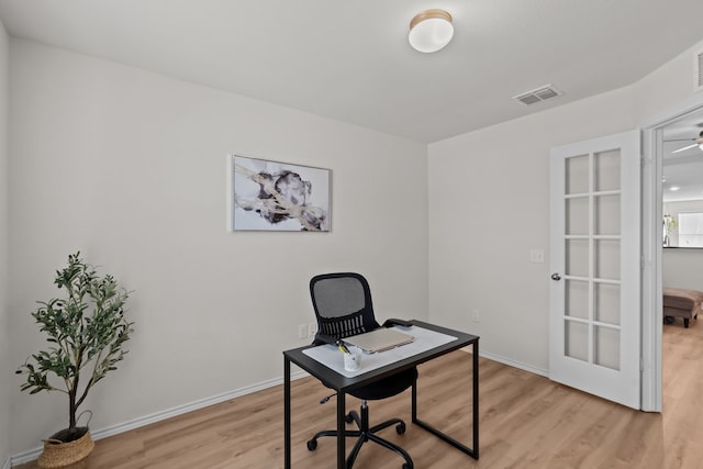 office with light hardwood / wood-style floors