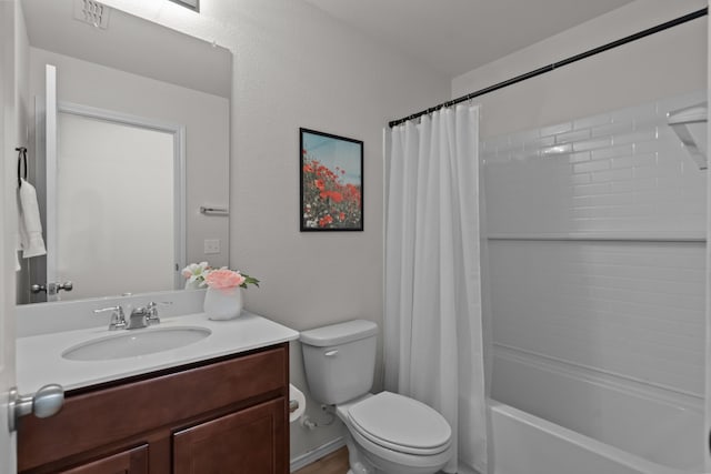 full bathroom with shower / bathtub combination with curtain, vanity, and toilet